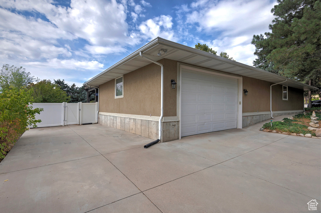 View of side of home with a garage