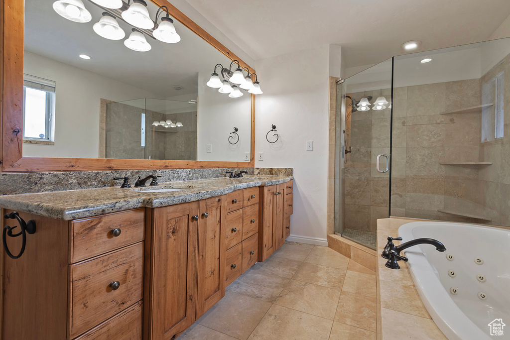 Bathroom featuring vanity and plus walk in shower