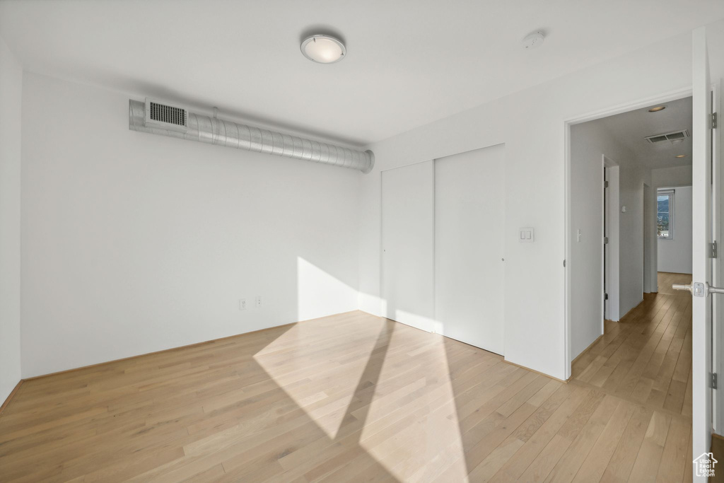 Unfurnished room with light hardwood / wood-style flooring