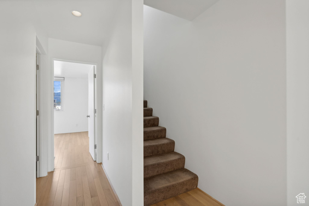 Stairs featuring wood-type flooring