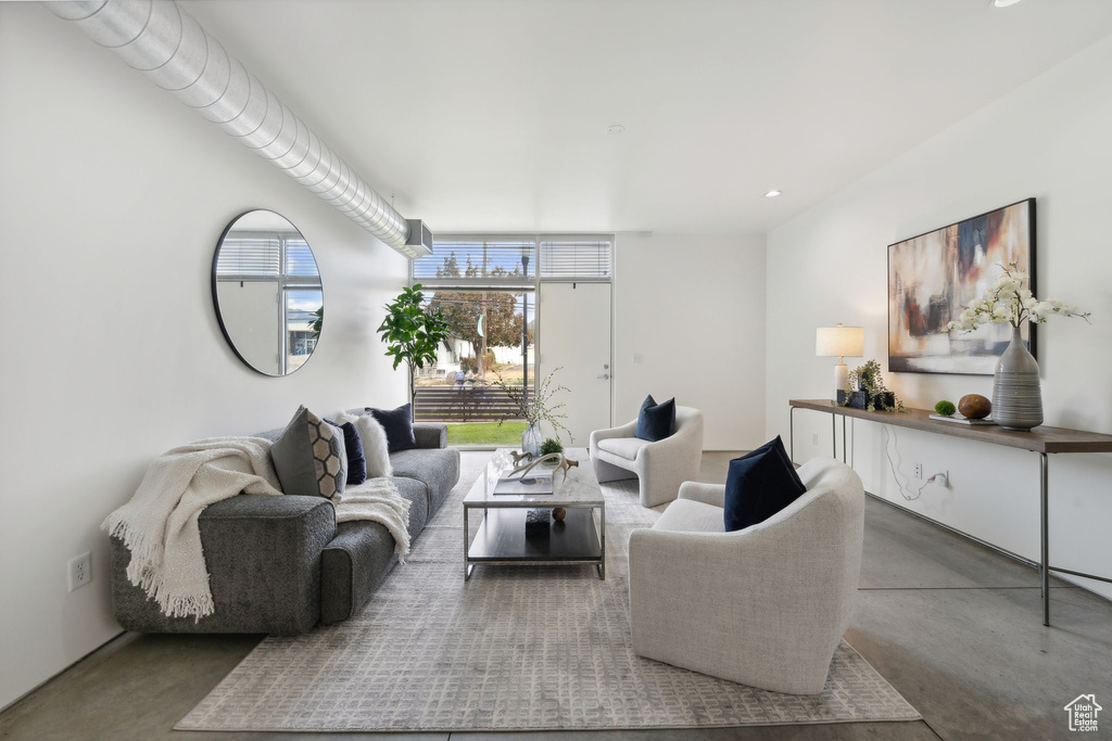 Living room featuring concrete flooring