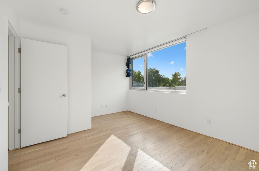 Unfurnished bedroom with light hardwood / wood-style flooring