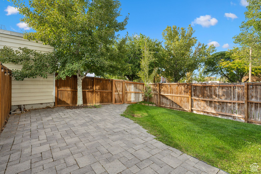 View of yard with a patio