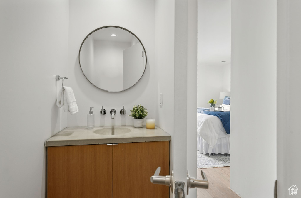 Bathroom featuring vanity and hardwood / wood-style floors