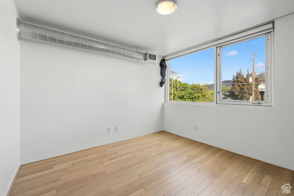 Empty room featuring light hardwood / wood-style flooring