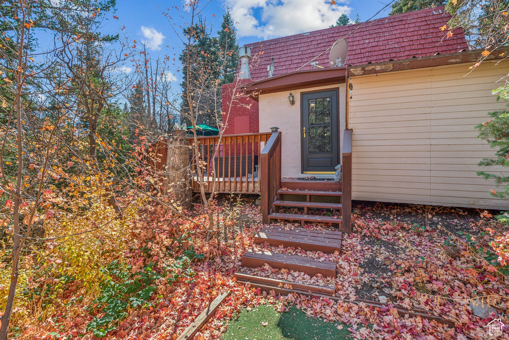 Property entrance featuring a deck