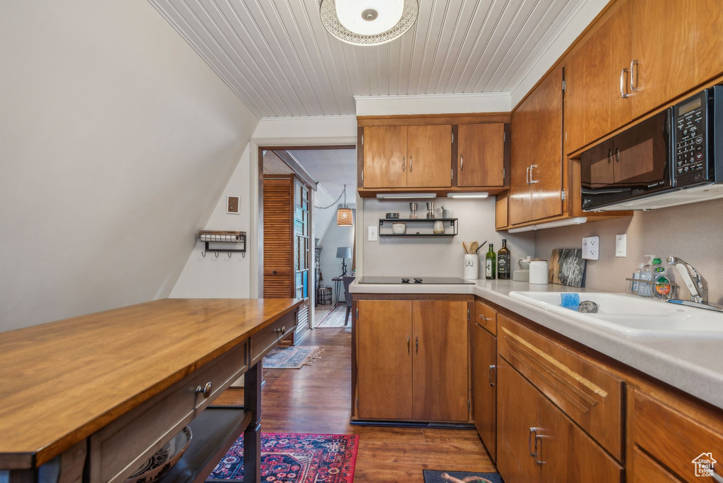 Kitchen with ornamental molding, sink, wooden ceiling, and dark hardwood / wood-style floors