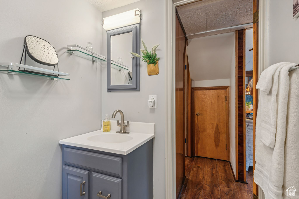 Bathroom with vanity and hardwood / wood-style floors