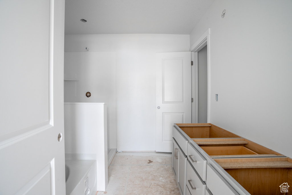 Bathroom with vanity and a bath