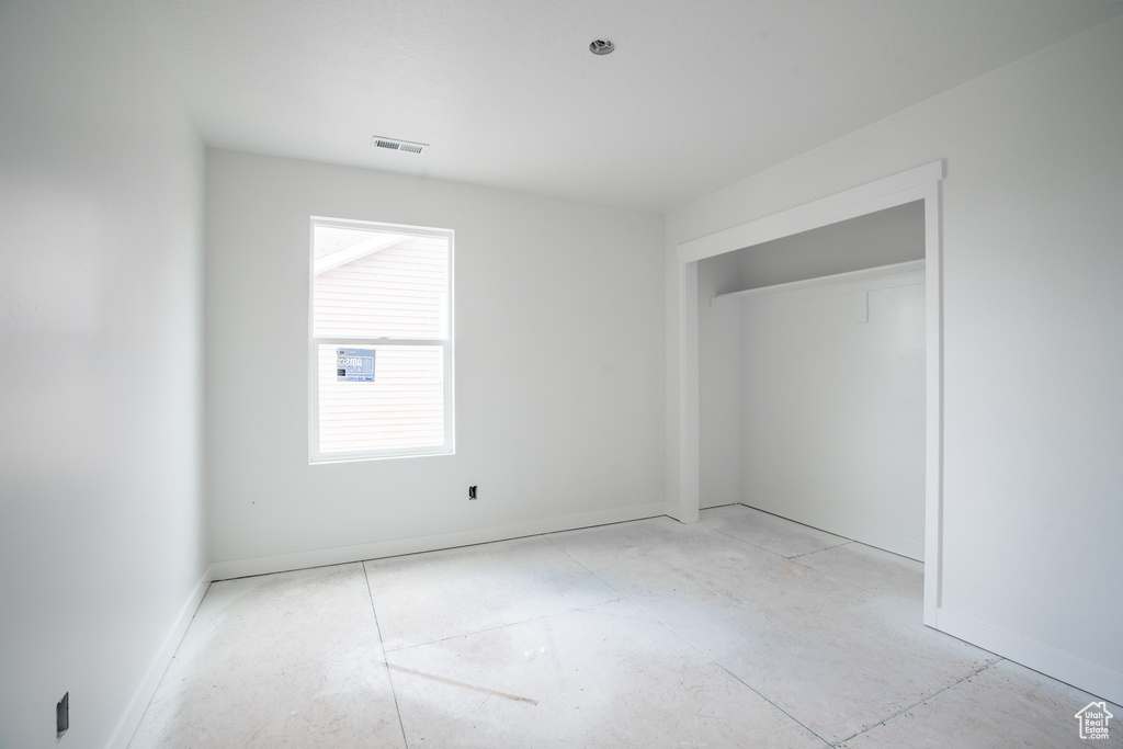 Unfurnished bedroom featuring a closet