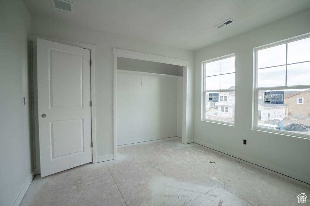 Unfurnished bedroom featuring a closet