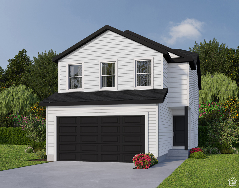 View of front facade with a front yard and a garage