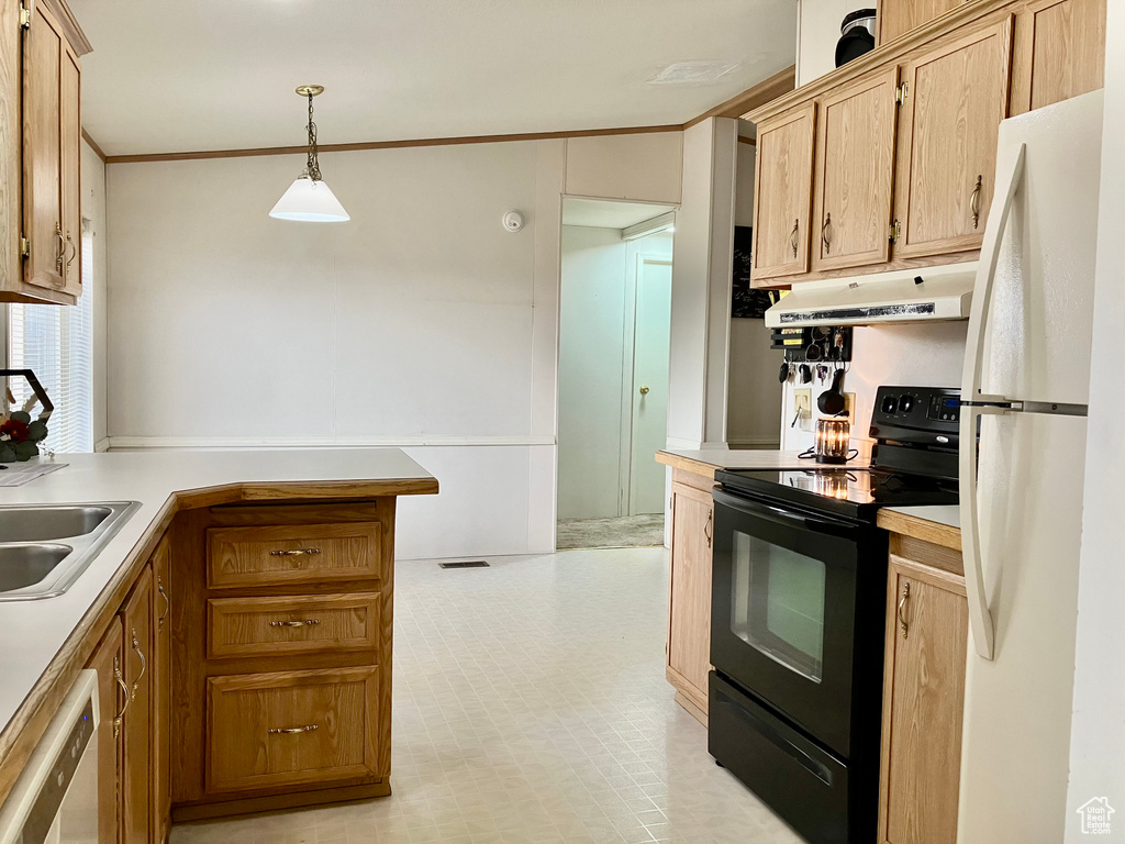 Kitchen featuring black electric range oven, hanging light fixtures, crown molding, and white refrigerator