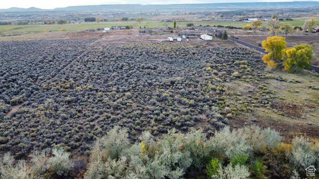 Drone / aerial view featuring a mountain view and a rural view