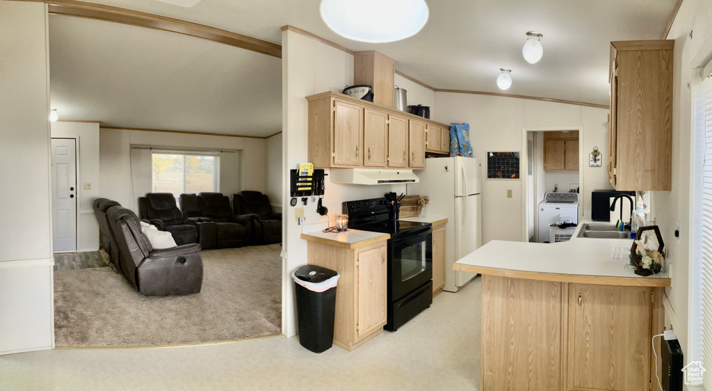 Kitchen featuring washer / clothes dryer, black range with electric stovetop, sink, vaulted ceiling, and white fridge