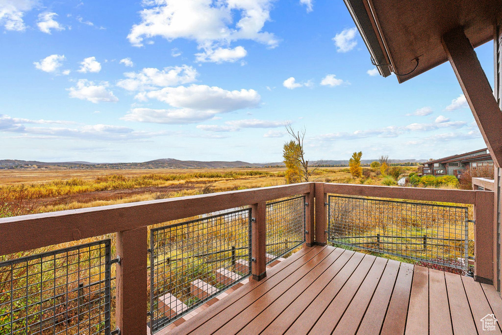 Wooden deck featuring a mountain view