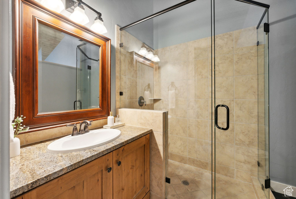 Bathroom with vanity and an enclosed shower