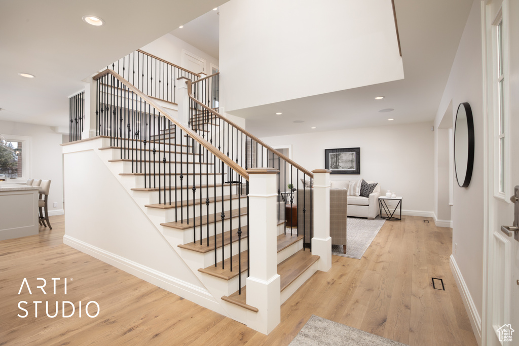 Stairway with hardwood / wood-style flooring