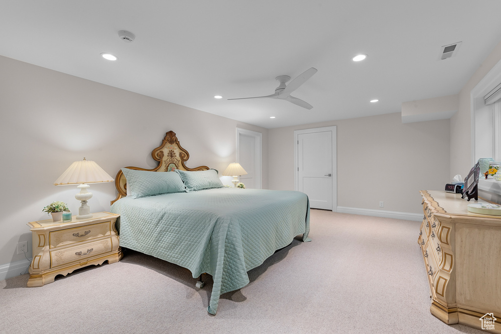 Bedroom featuring ceiling fan and light colored carpet