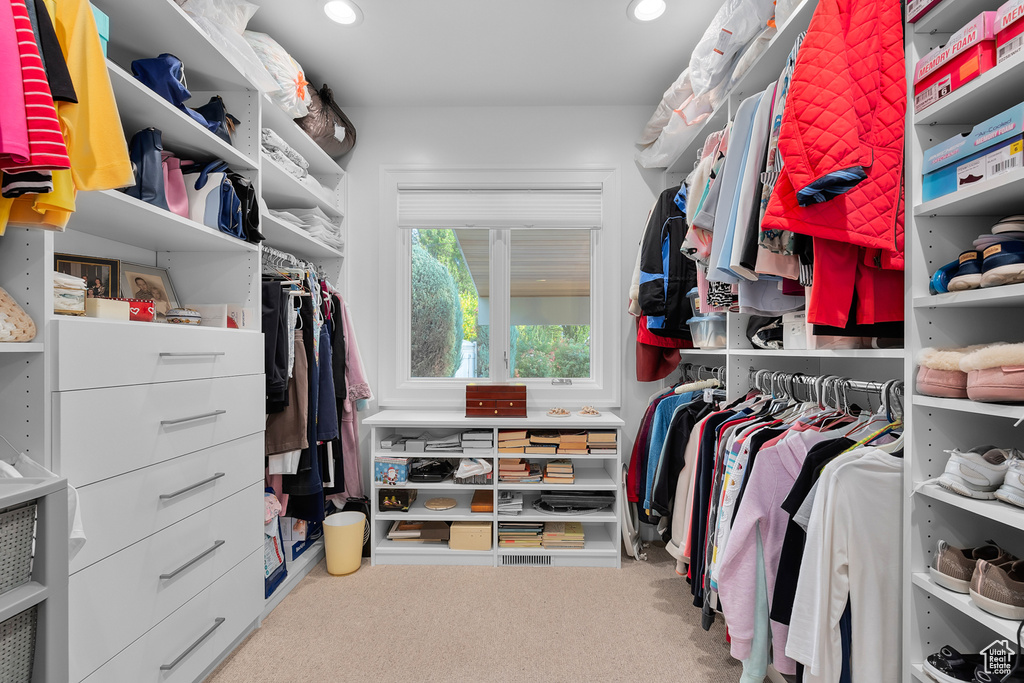 Spacious closet with carpet floors