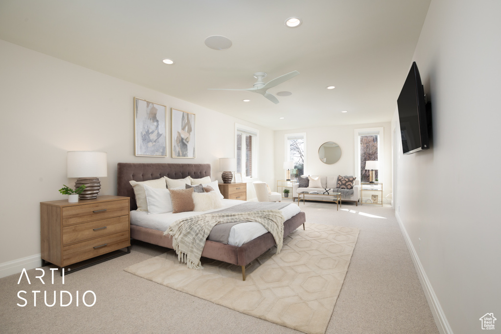 Carpeted bedroom with ceiling fan