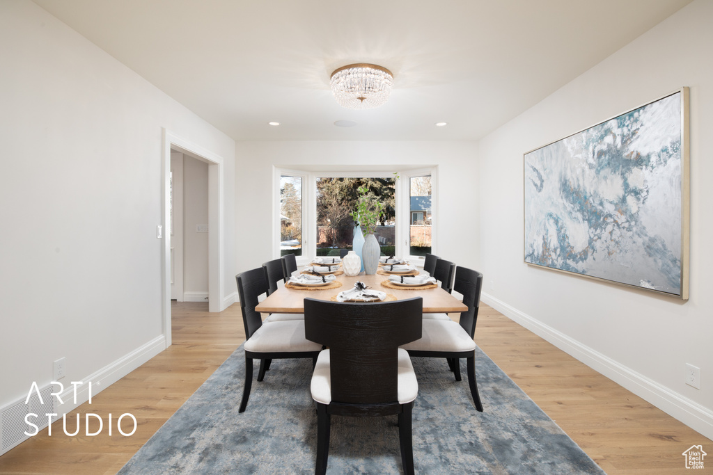 Dining room with hardwood / wood-style floors