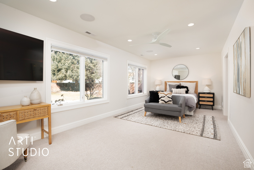 Bedroom with ceiling fan and carpet