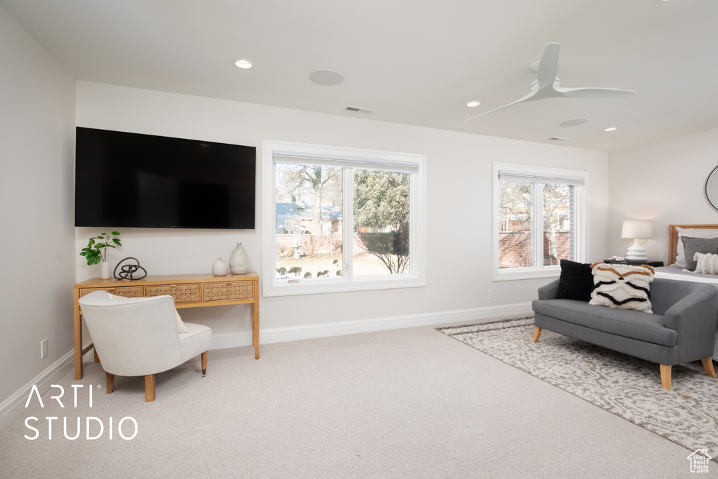 Interior space with carpet and ceiling fan