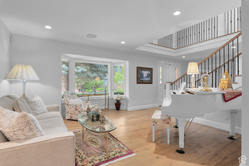 Living room with light hardwood / wood-style floors