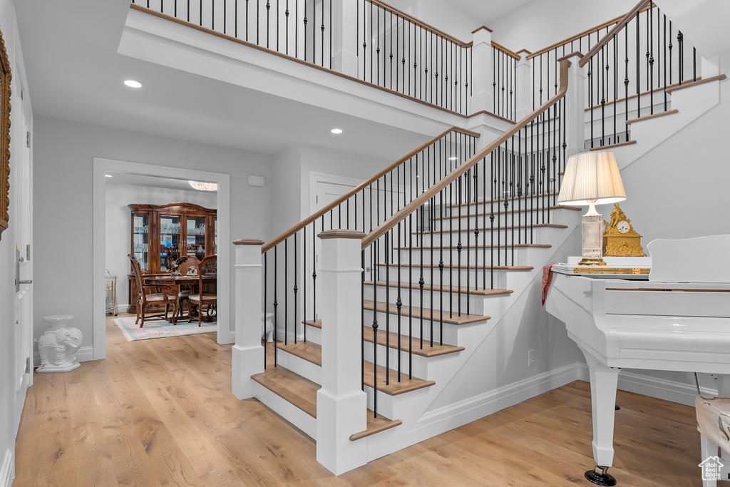 Staircase with hardwood / wood-style flooring