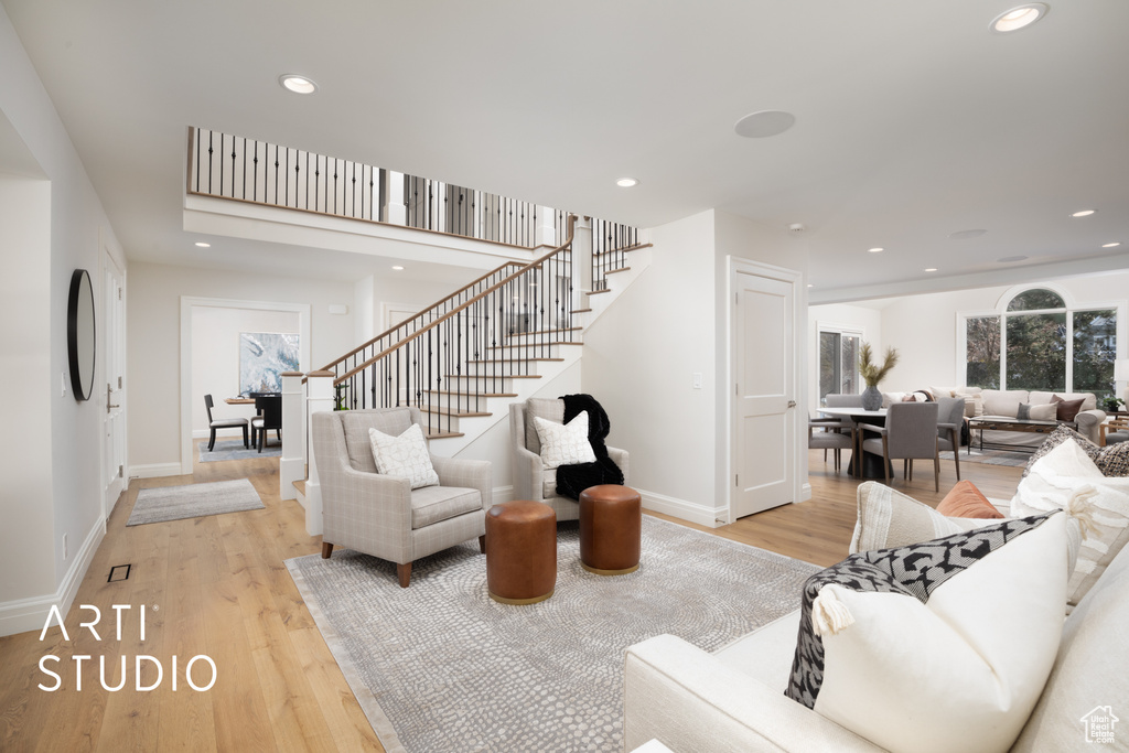 Living room with light hardwood / wood-style floors