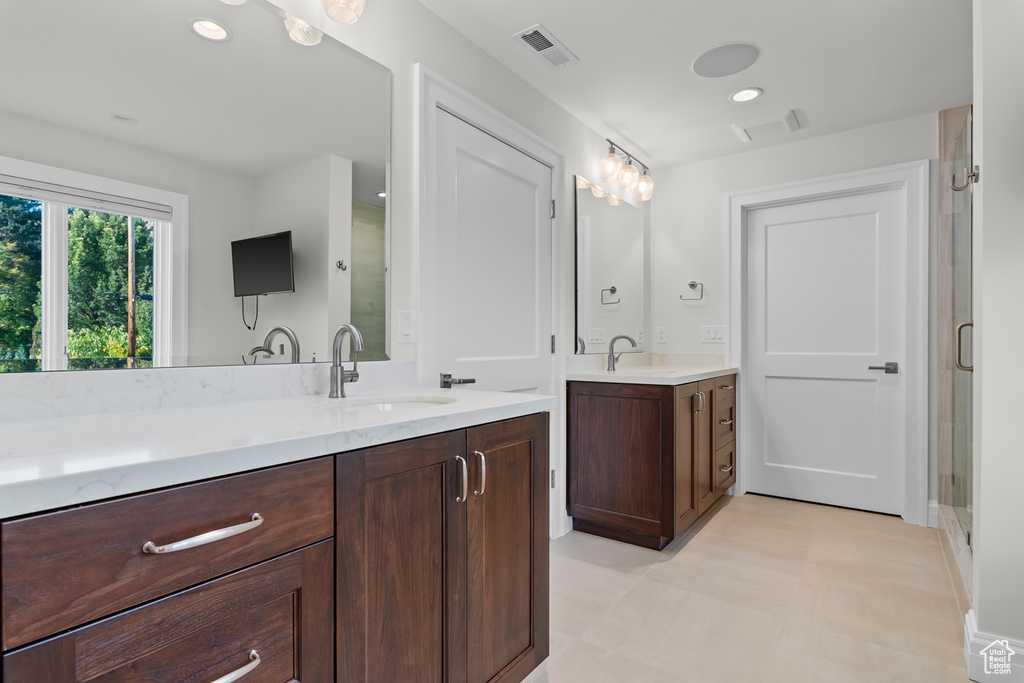 Bathroom with vanity and walk in shower