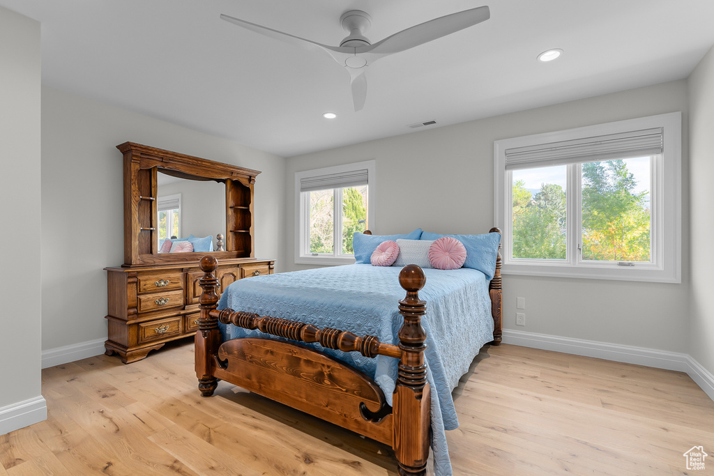 Bedroom featuring light hardwood / wood-style flooring and ceiling fan