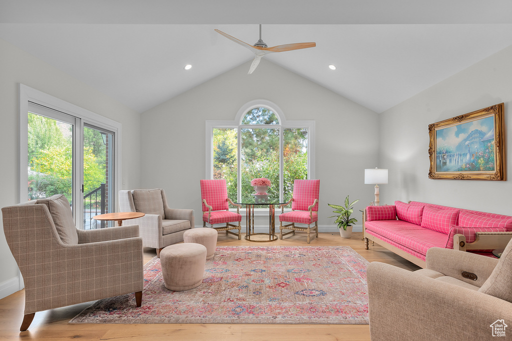 Living room featuring light hardwood / wood-style floors, a healthy amount of sunlight, and ceiling fan