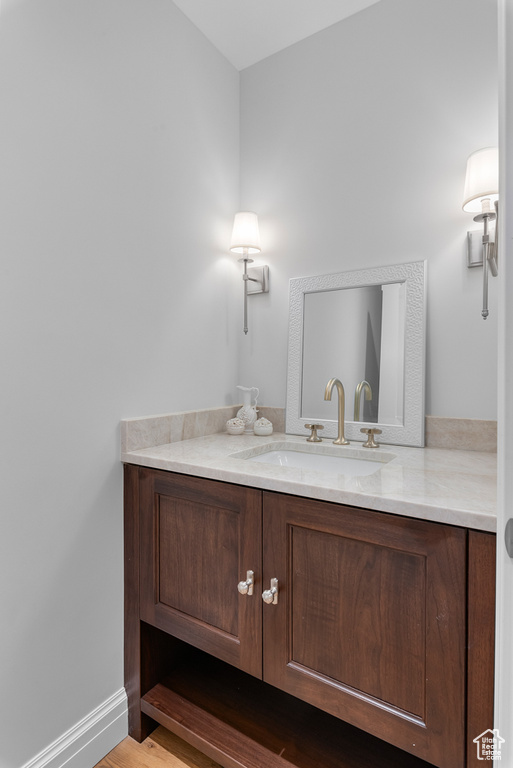 Bathroom featuring vanity and hardwood / wood-style flooring