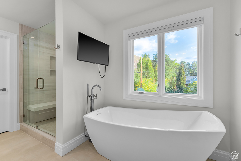 Bathroom featuring separate shower and tub