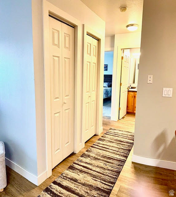 Hallway featuring light hardwood / wood-style flooring