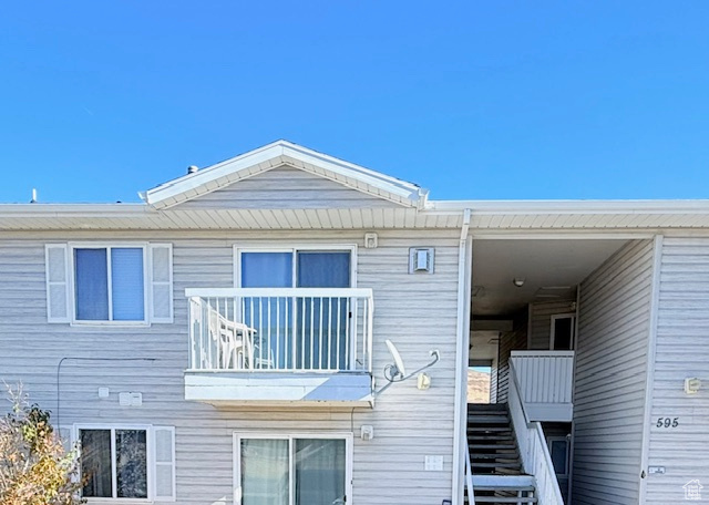 Rear view of house with a balcony