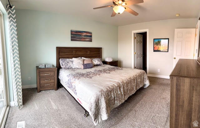 Bedroom with carpet and ceiling fan