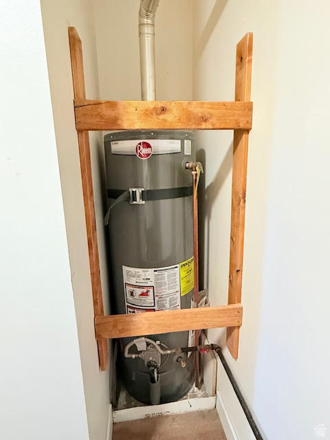 Utility room featuring gas water heater