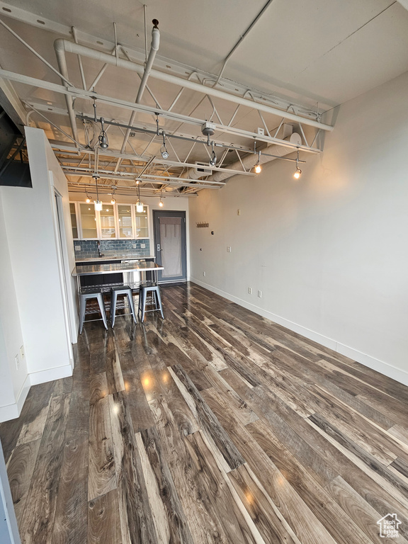 Interior space with dark hardwood / wood-style flooring