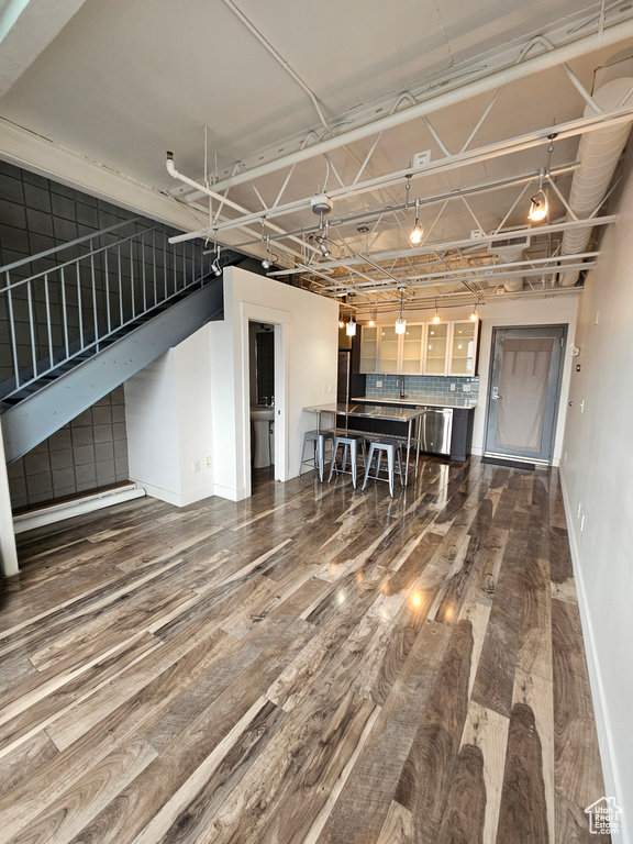 Unfurnished living room featuring hardwood / wood-style floors