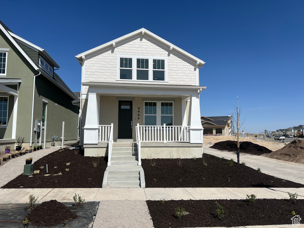 View of front of home featuring covered porch
