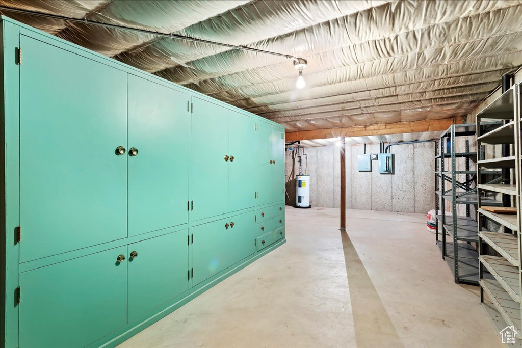 Basement with electric panel and water heater