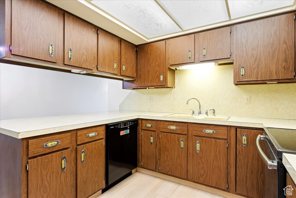 Kitchen with sink, dishwasher, and stainless steel stove