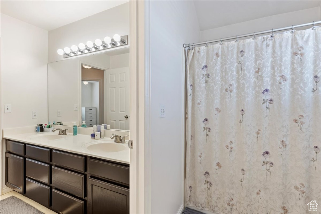 Bathroom featuring vanity and walk in shower