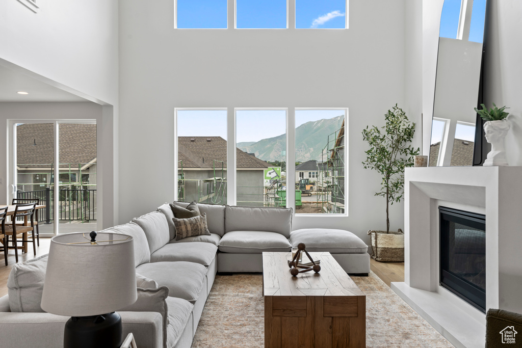 Living room featuring a mountain view and a towering ceiling