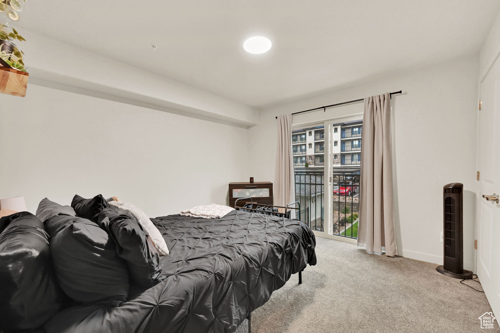 Bedroom with light colored carpet