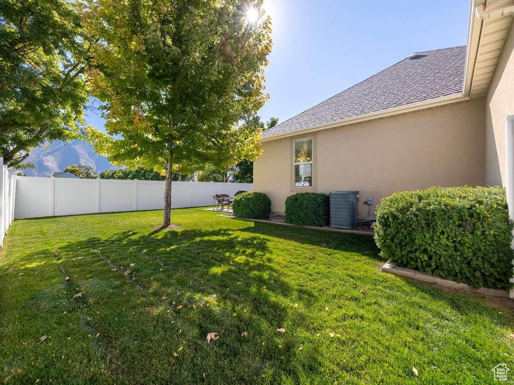 View of yard featuring central AC