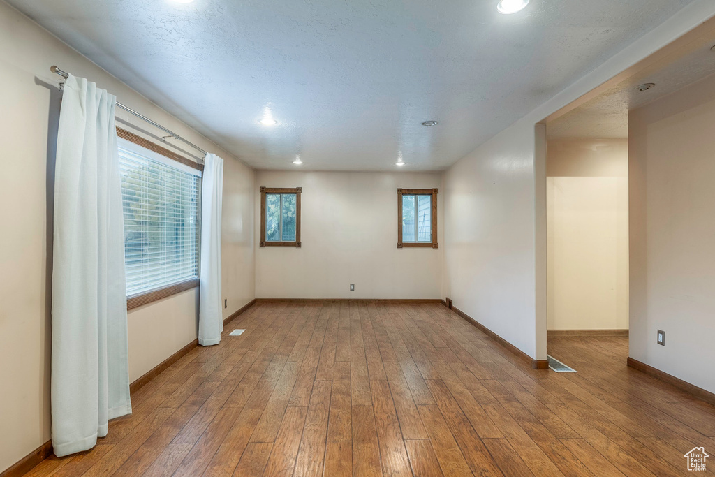 Unfurnished room with hardwood / wood-style floors